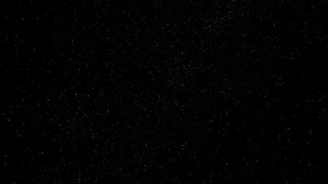 Cinematic night sky star field motion background featuring dense starry constellations and distant milky way galaxy glow.