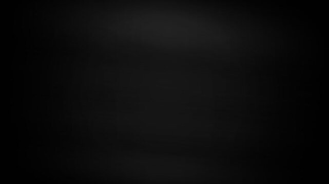 A deep and dark solid black background with subtle gray gradient lighting