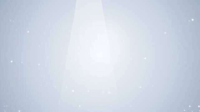 A soft vertical beam of light emerging from the top on a pale grey background