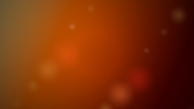Abstract background with soft orange and brown gradient light bokeh effect