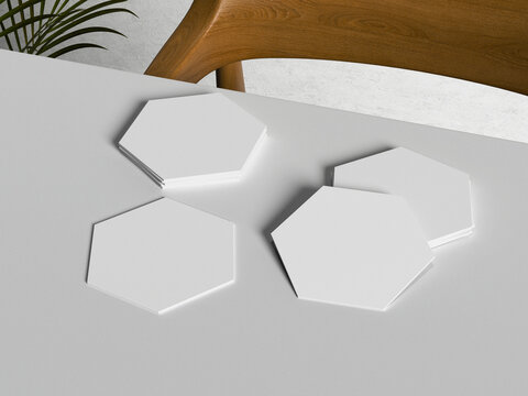 Blank white hexagon coasters mockup on desk with wooden furniture