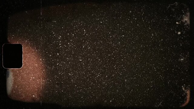 Dark textured background with vintage film grain and light scratches for retro design
