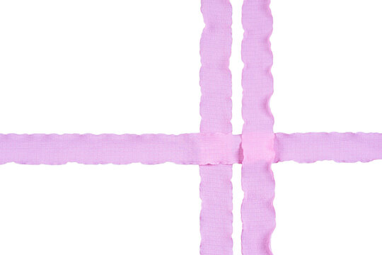 Pink wavy wrinkled crepe ribbon strips crossing in an asymmetric grid isolated on a transparent background