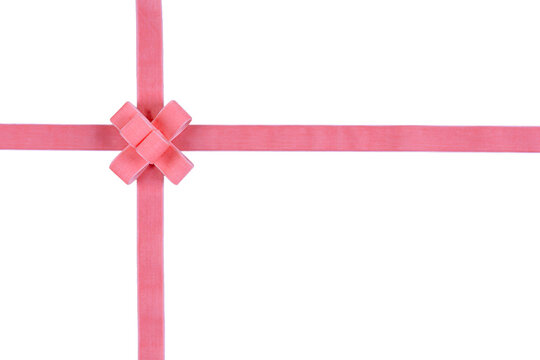 Soft pink velvet wrapping ribbon crossed with upper left decorative square knot isolated on transparent background