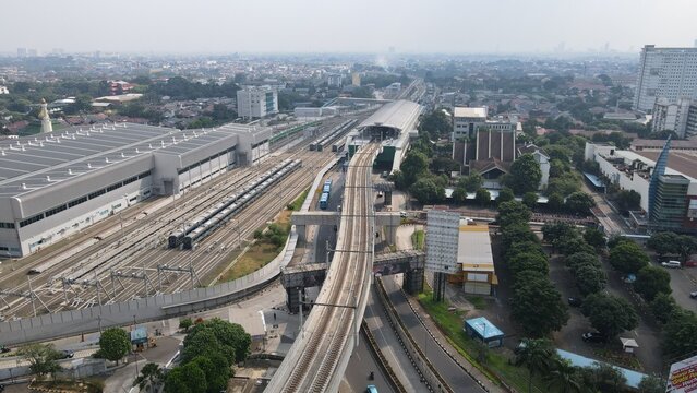 Aerial view of Stasiun MRT Lebak Bulus with elevated train tracks and modern station architecture in Kecamatan Kebayoran Lama, Daerah Khusus Ibukota, Indonesia.