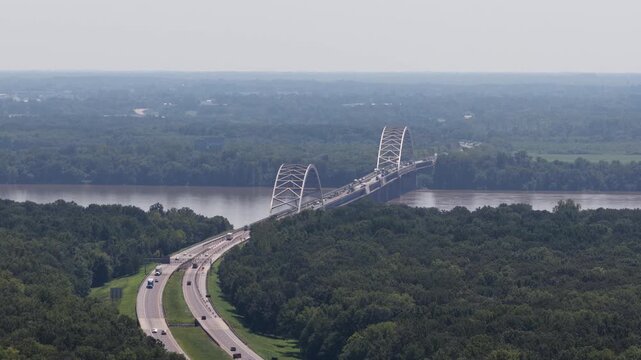 Aerial of Paducah Bowstring Truss Bridge over Ohio River on Illinois and Kentucky border with hazy sky