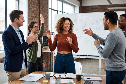 Diverse group cheering successful Latina woman in office