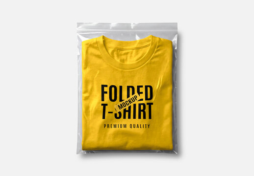 Folded Yellow T-Shirt Mockup in Plastic Packaging Bag Top View