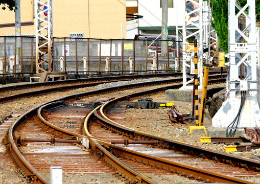 Multiple railroad tracks curving on railway switches
