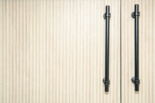 Stylish cabinet doors feature smooth grain and bold handles