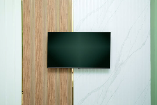 Wall-mounted television integrates seamlessly into stylish home interior