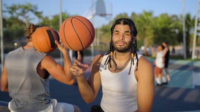 Young basketball player spinning ball on finger