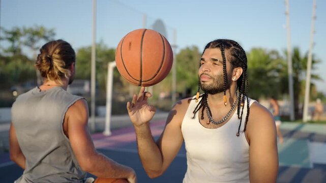Talented basketball player spinning ball on finger