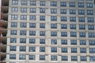 New apartment building construction site with no workers present in urban area during day © beholdereye