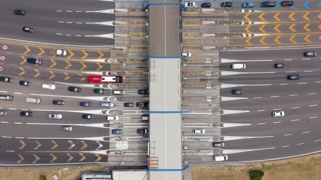 Aerial documentation of busy traffic passing through the Milano Sud toll plaza on the A1, capturing a key transportation corridor and everyday vehicle movement near Milan.