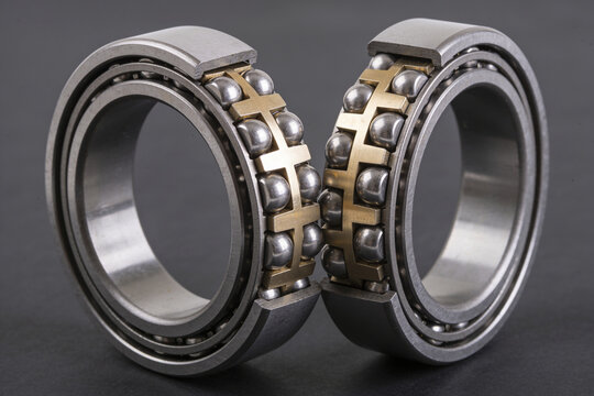 Two precision ball bearings showing inner race balls and cage