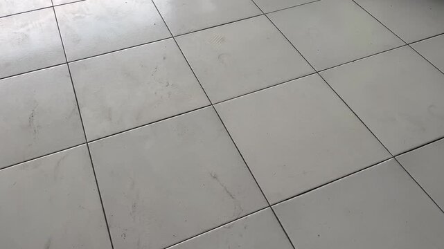 High angle view of white ceramic floor tiles grid