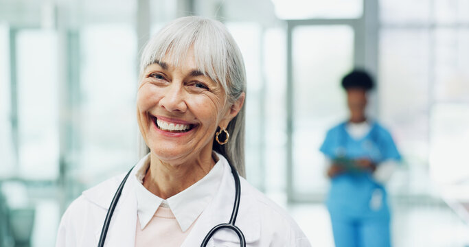 Portrait, woman and doctor in clinic for medical service, smile and pride with career experience. Mature person, happy healthcare worker and physician in hospital, general practitioner or about us
