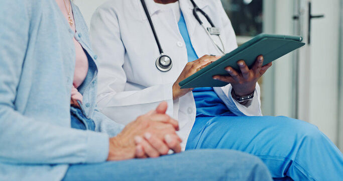 Doctor, tablet and old woman hands with consultation, disease diagnosis or treatment plan in clinic. Medical worker, senior person and meeting with tech, online test results and checkup for health