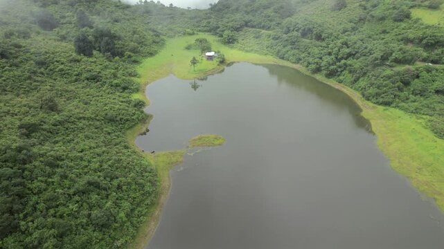 4K drone aerial view of Yala Provincial Park in Jujuy, Argentina. Misty mountain lakes surrounded by lush Yungas forests and dense green vegetation in a spectacular Andean landscape.
