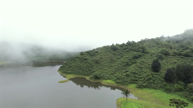 4K drone aerial view of Yala Provincial Park in Jujuy, Argentina. Misty mountain lakes surrounded by lush Yungas forests and dense green vegetation in a spectacular Andean landscape.