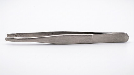 Fototapeta premium close-up view of a single stainless steel pair of tweezers on a white background