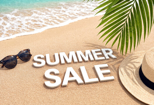 Bright summer sale advertisement on sandy beach with sunglasses hat and palm leaf by ocean waves