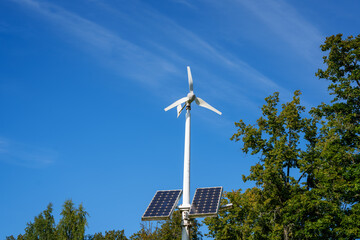 wind turbine against blue sky © talavietis