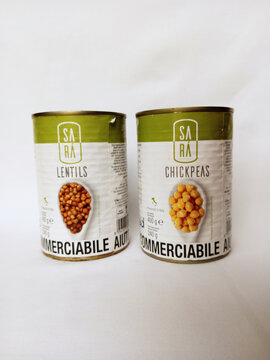 Cans of Sara Lentils and Chickpeas on white background. Canned legumes packed in brine with sealed metal lid. Same brand, different products. Kumasi, Ghana - April 16, 2026