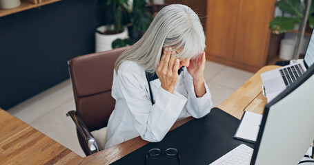 Naklejka na ściany i meble Stress, headache and doctor in office at clinic with fatigue, burnout or bad news on patient results. Woman, migraine and mature healthcare worker with exhaustion for medical mistake in hospital.