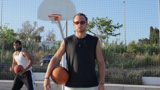 Determined basketball player portrait on an outdoor court
