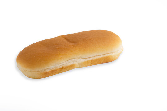 Single fresh soft hot dog bun isolated on clean white background, fast food baked ingredient.