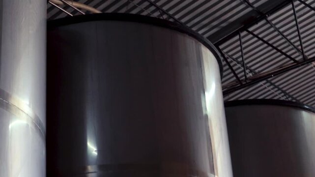 Stainless steel fermentation tanks in tequila distillery