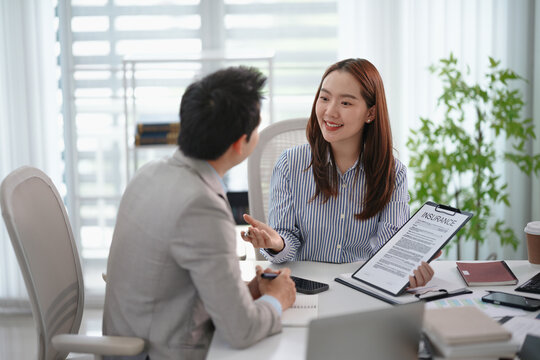 Real estate agent broker and customer with loan or insurance contract documents