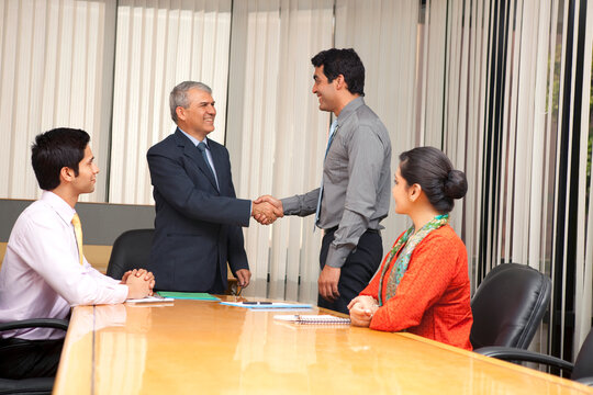 Business executives shaking hands