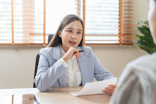 Business professional listening carefully during meeting or consultation at office