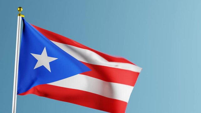 Puerto rican flag waving in wind against blue sky background.