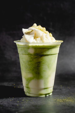 Matcha Frappe Iced Green Tea Beverage in Plastic Cup