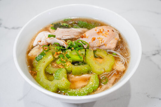 Asian Chicken Noodle Soup with Bitter Melon in a Bowl