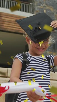 Animation of gold confetti over celebrating diverse schoolgirls with mortar boards and diplomas