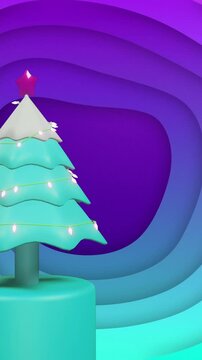 Christmas tree, bauble and present on rotating podium over blue and purple background