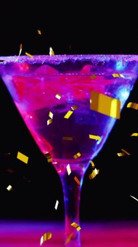 Animation of confetti falling and cocktail on black background