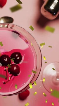 Animation of confetti falling and cocktail on pink background