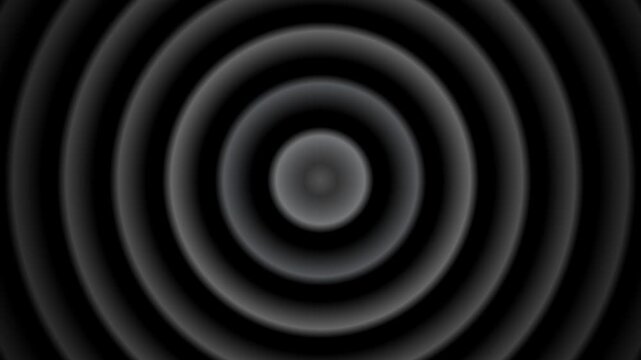 Concentric black and gray ripples radiating from a central focal point creating a seamless looping background