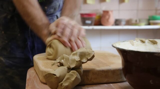 The hands of potter at work
