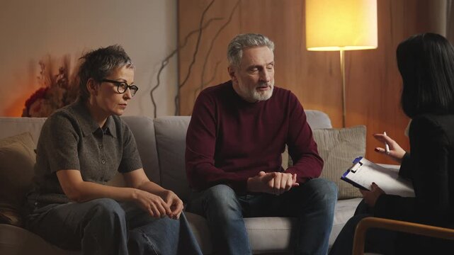 Stressed middle-aged man complains about wife to psychologist during therapy
