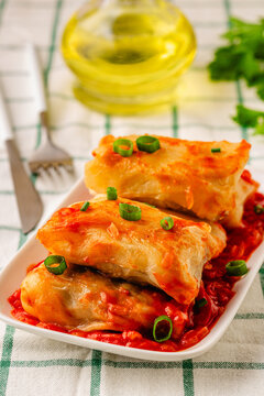 Delicious stuffed cabbage rolls served with tomato sauce