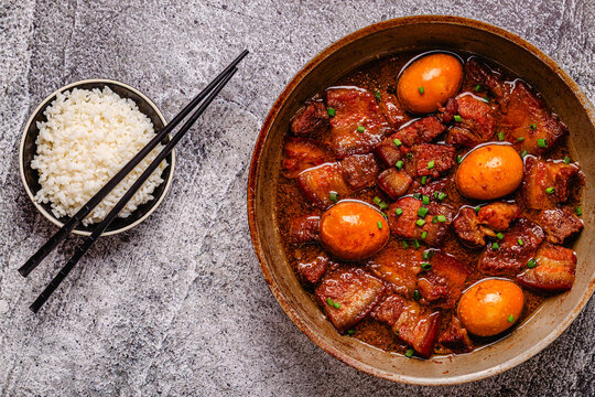 Braised pork belly and eggs. Traditional Southeast Asian cuisine