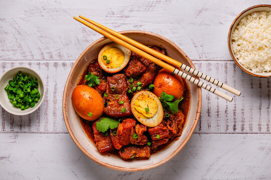 Braised pork belly and eggs. Traditional Southeast Asian cuisine