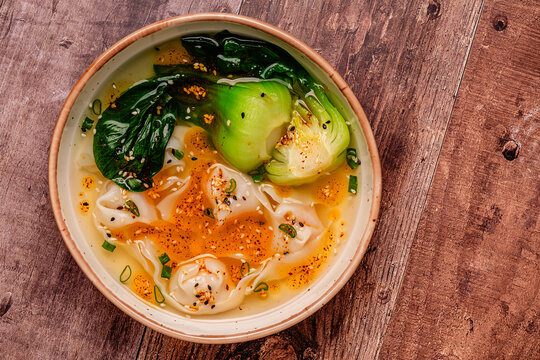Soup with wontons and bok choy